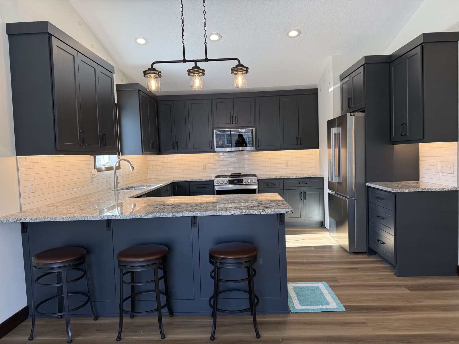 Remodelled kitchen with island seating, Northfield MN by BN Builders